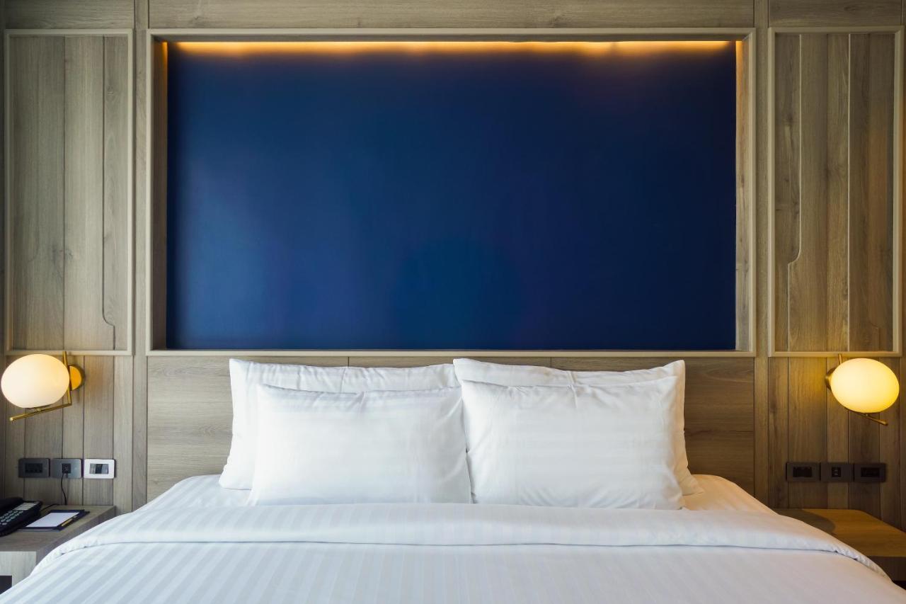 Seabed Grand Hotel Phuket - Sha Extra Plus Kültér fotó A bed with two pillows